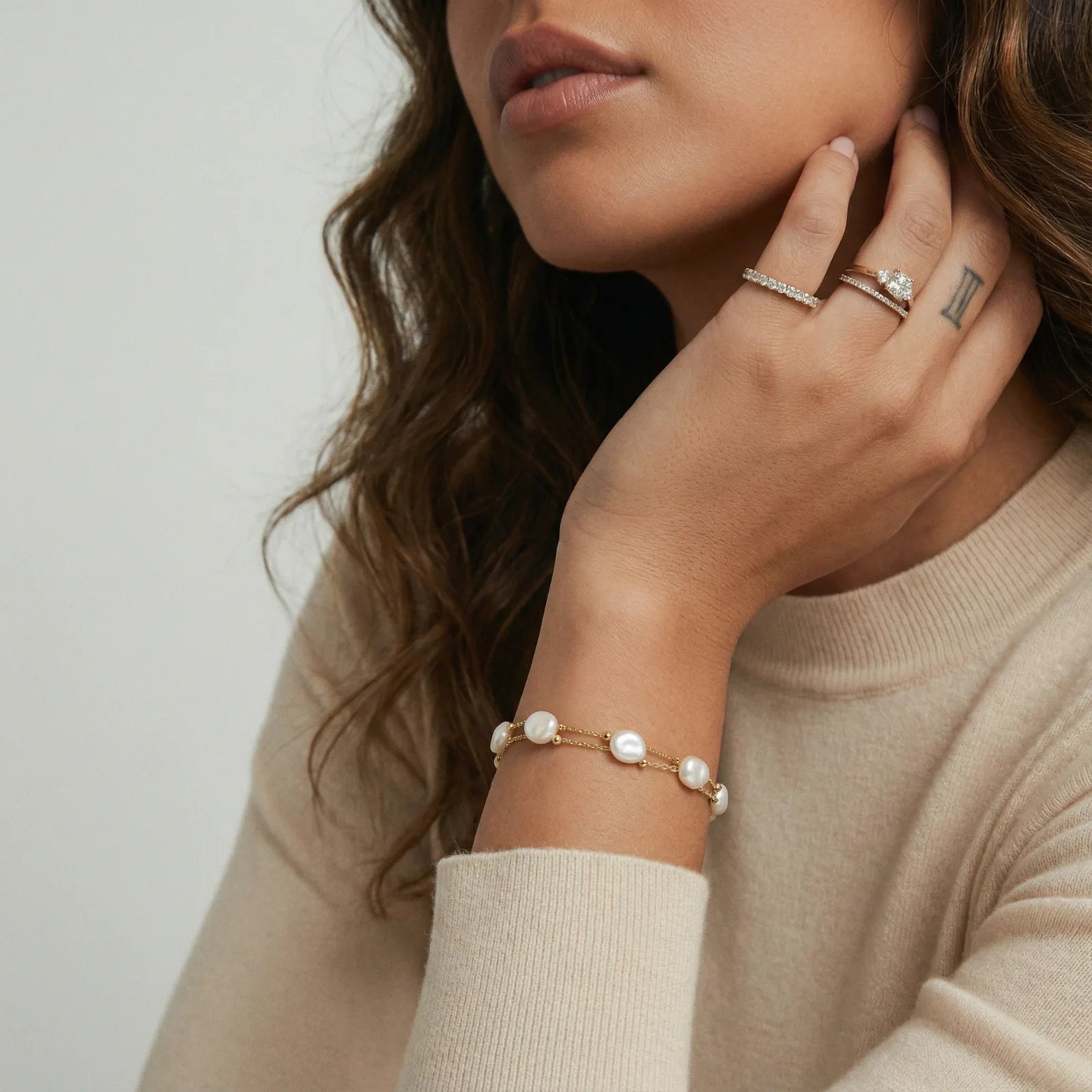 Baroque pearl and gold layered bracelets collection